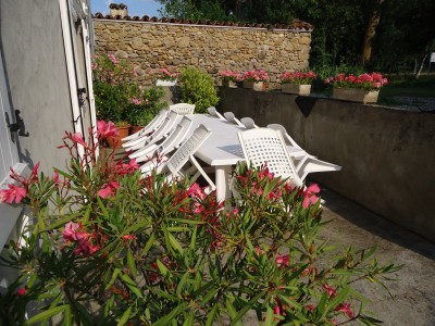 Southfacing, sunny terrace  -   and very flowery.   Great for breakfast and late in the evening.
